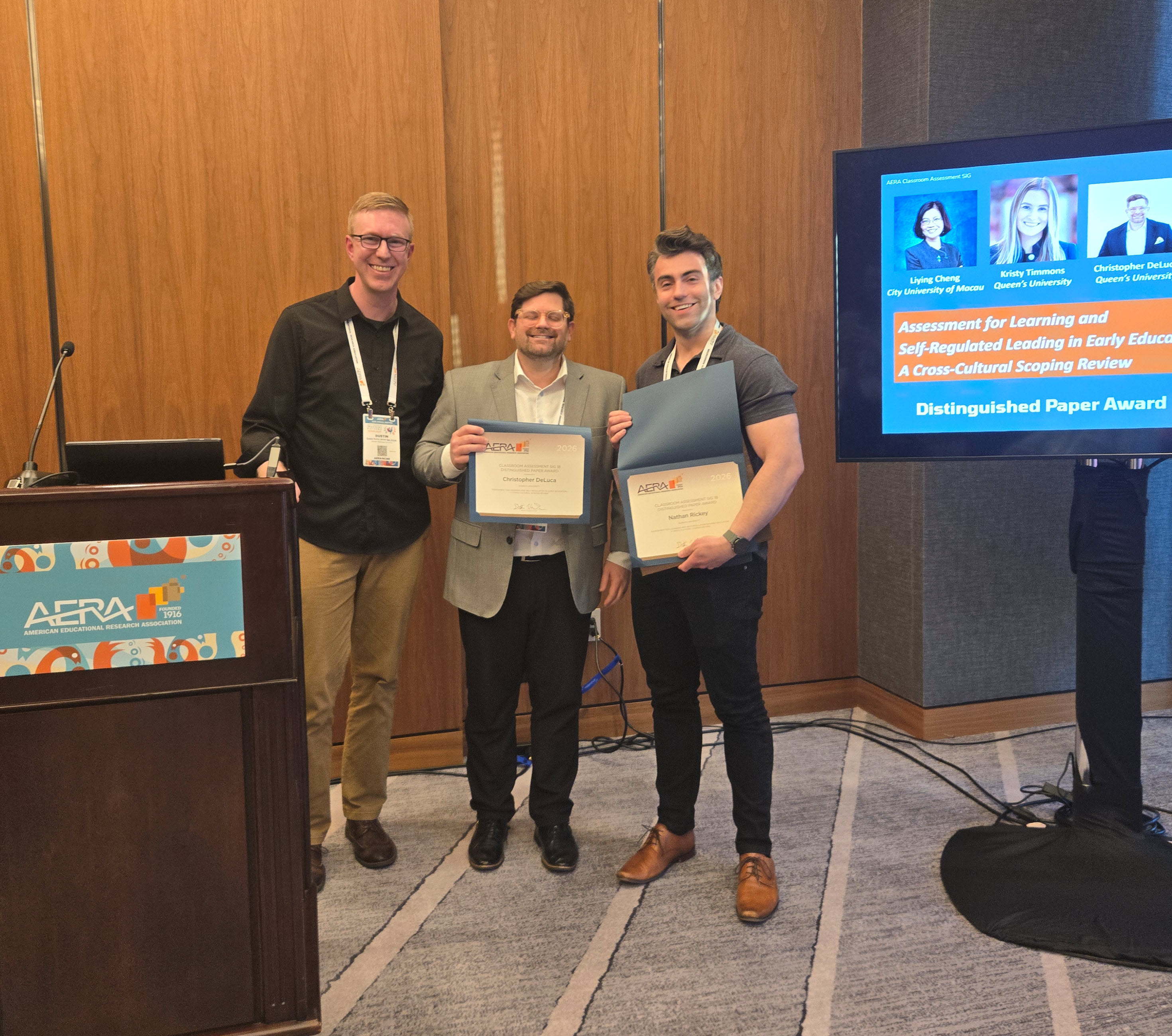 Distinguished paper award winners Chris Deluca and Nathan Rickey accept the awards for all of the authors of the winning paper in 2026