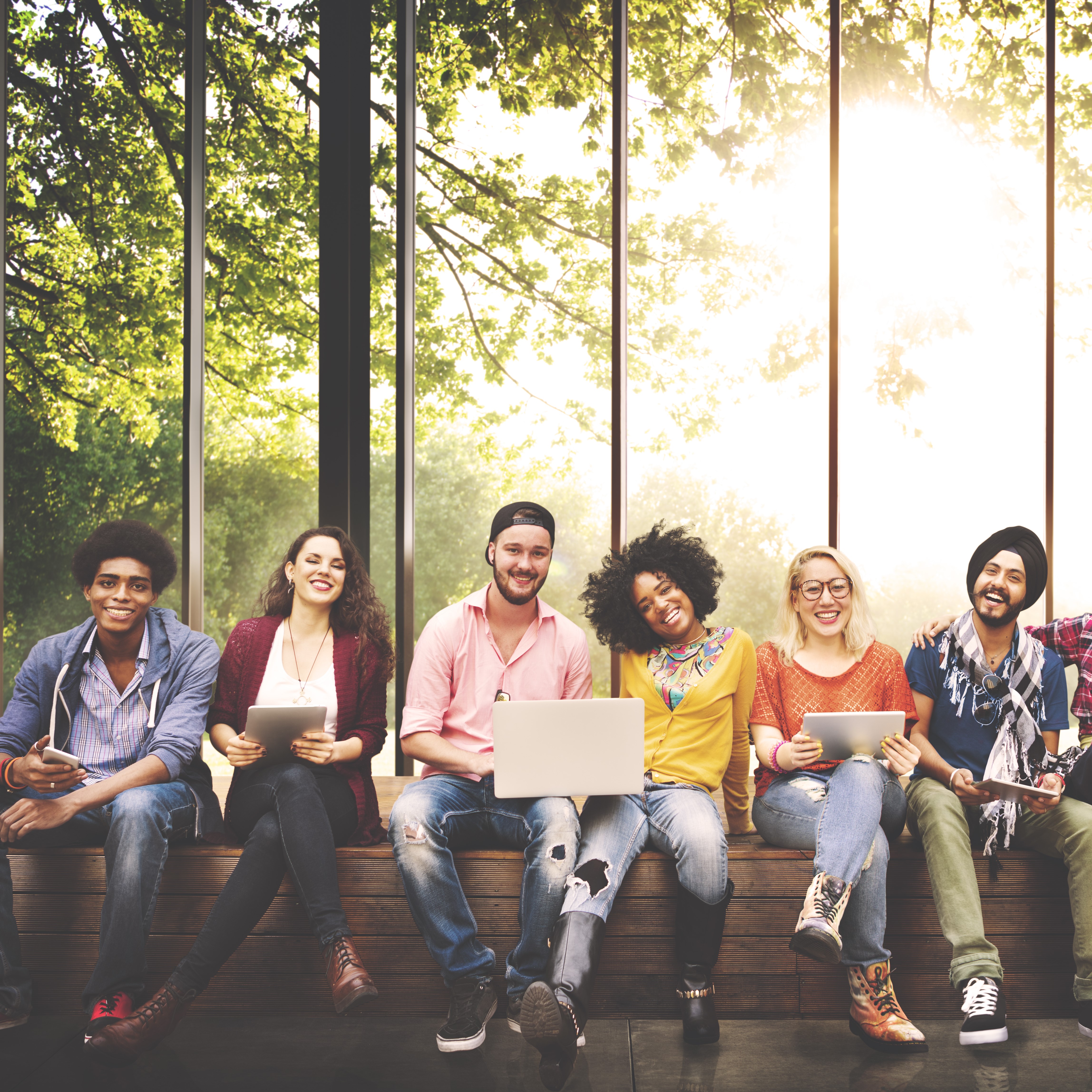 Diverse group of young adults smiling at the camera